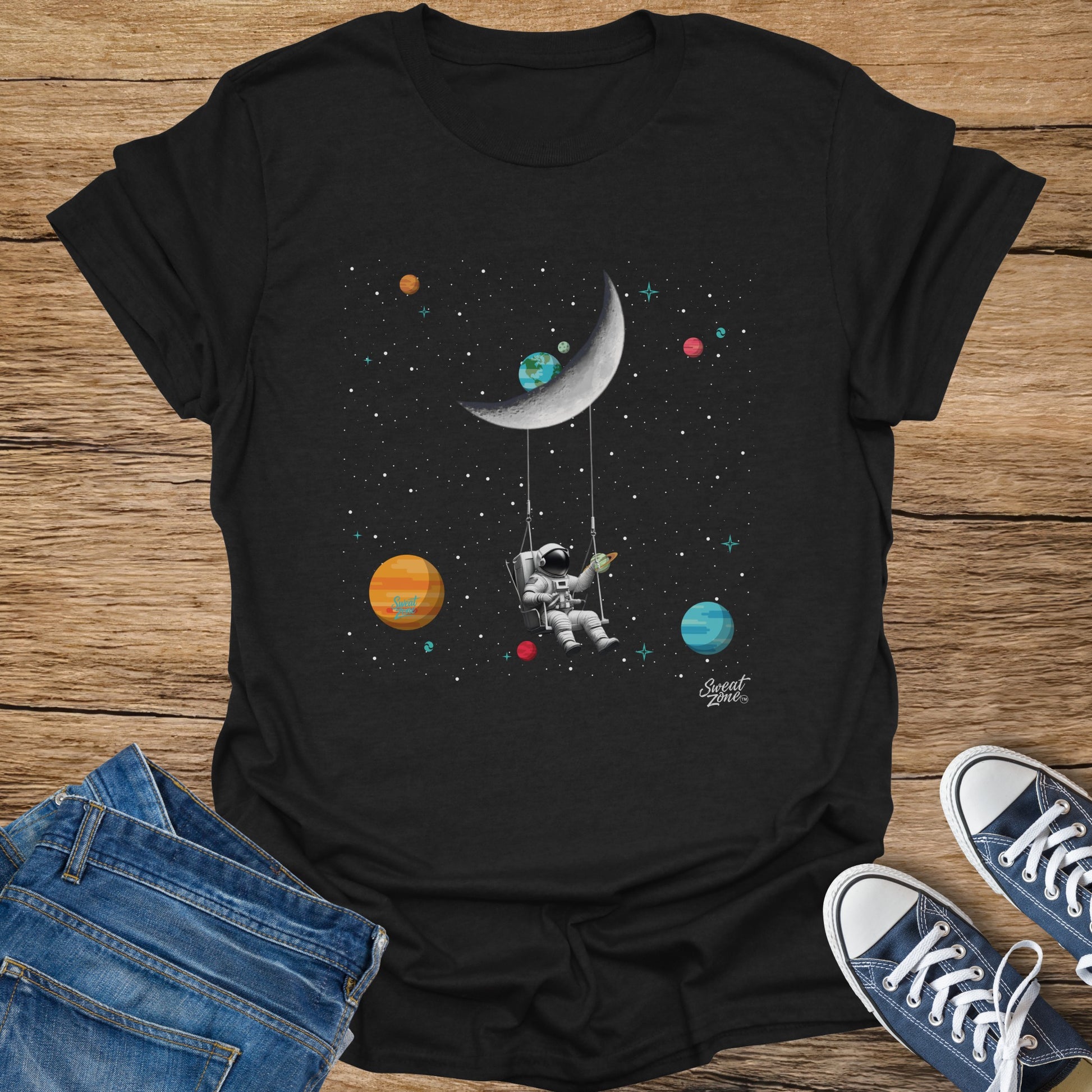 Astronaut swinging on the moon amidst planets and stars, with "Sweat Zone" text.