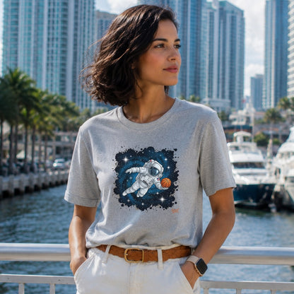 Grey t-shirt with astronaut playing basketball in space graphic.