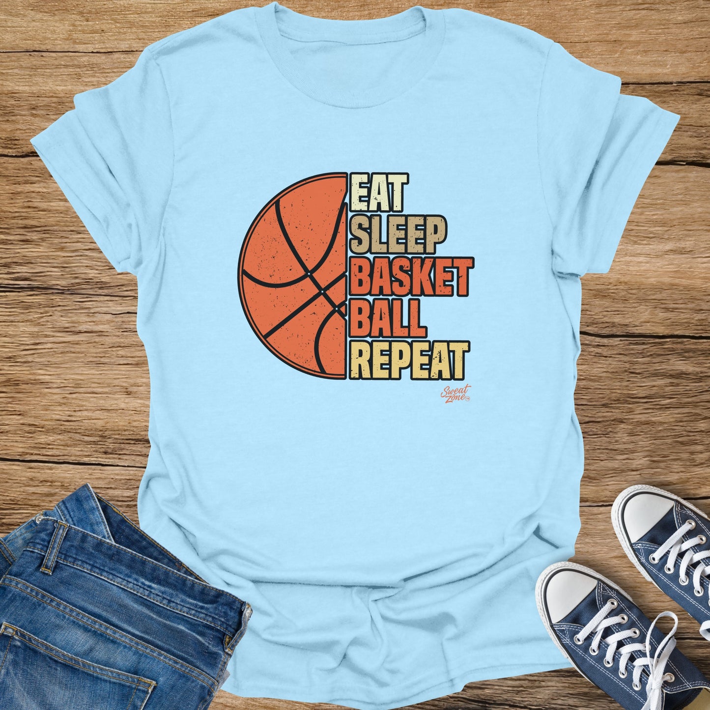 Light blue t-shirt with "Eat Sleep Basket Ball Repeat" graphic and basketball.