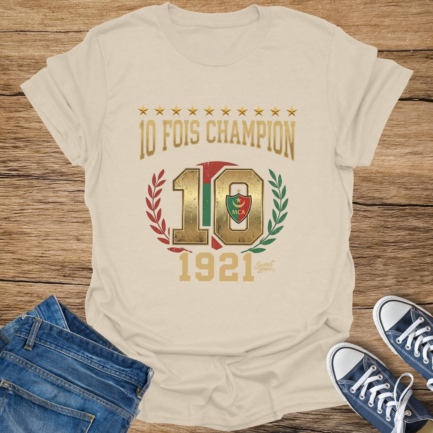 Cream t-shirt with "10 FOIS CHAMPION" text, a large "10", and "1921" graphic.