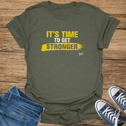 Olive t-shirt with yellow text "IT'S TIME TO GET STRONGER" and "Sweat Zone" logo.