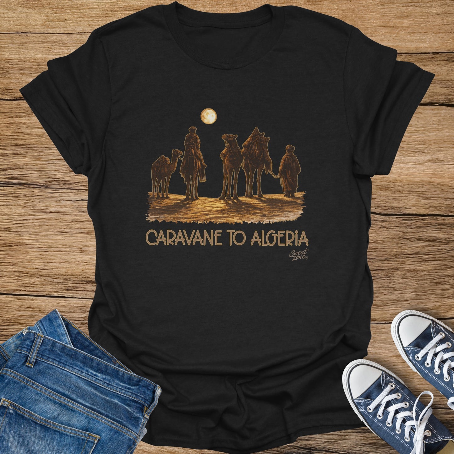 Black t-shirt with a desert caravan scene and "Caravane to Algeria" text.