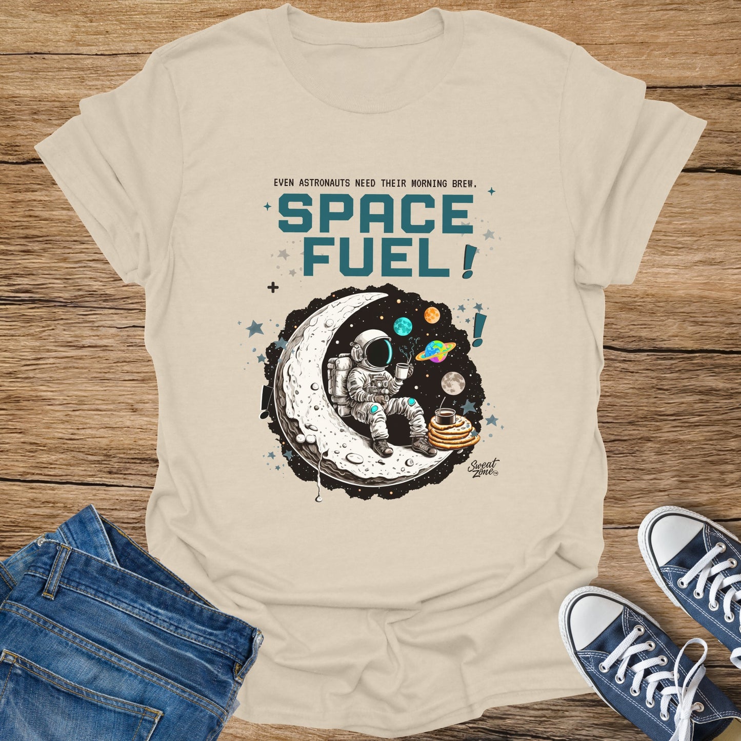 Astronaut on moon with coffee and pancakes, text "Space Fuel".