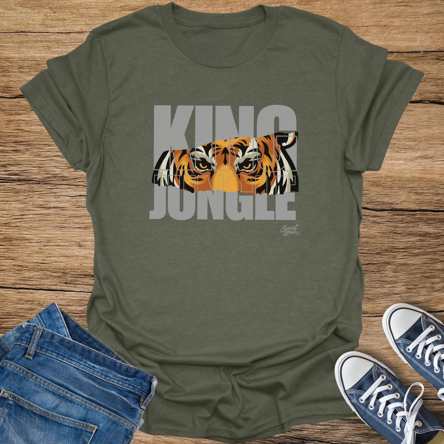 Olive t-shirt with "KING JUNGLE" text and a tiger's eyes.