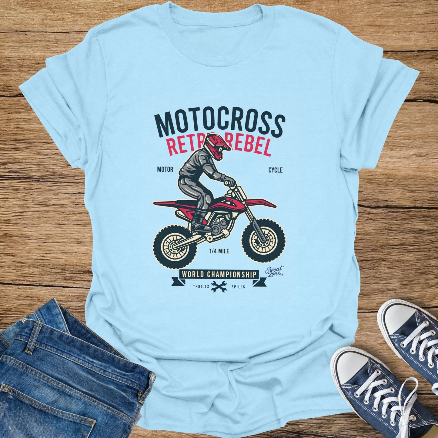Light blue t-shirt with Motocross Retro Rebel graphic of a rider and motorcycle.