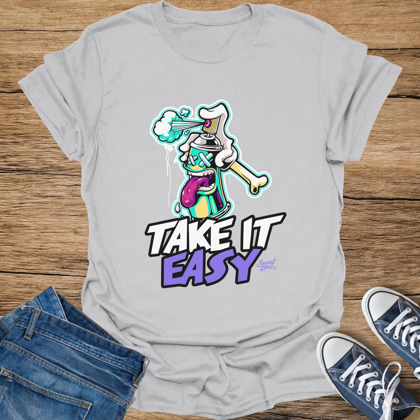 Grey t-shirt with cartoon spray can and "Take It Easy" text.