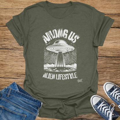 Green t-shirt with "AMONG US ALIEN LIFESTYLE" text and a UFO graphic.