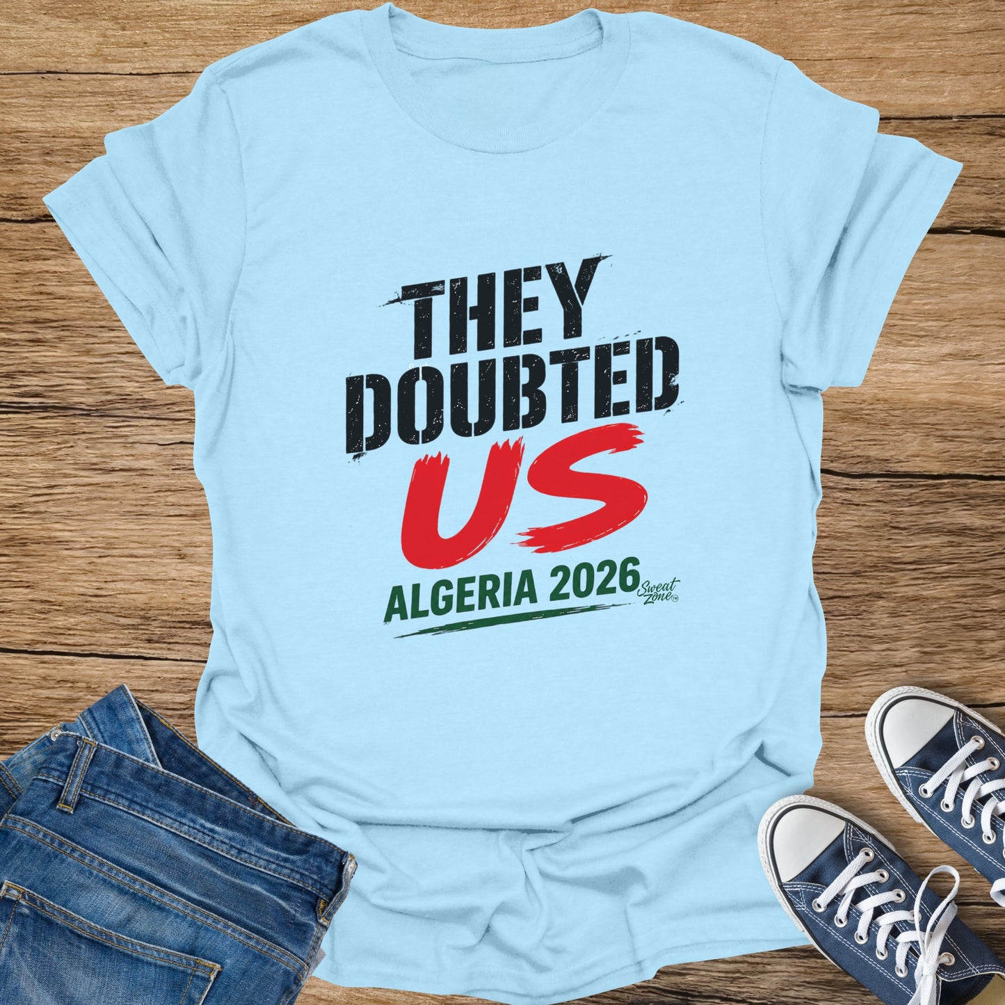Light blue t-shirt with "They Doubted US" and "Algeria 2026" text.