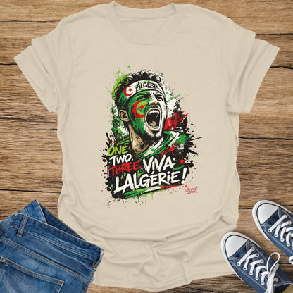 Algerian fan with painted face yells "One Two Three Viva L'Algerie" on a t-shirt.