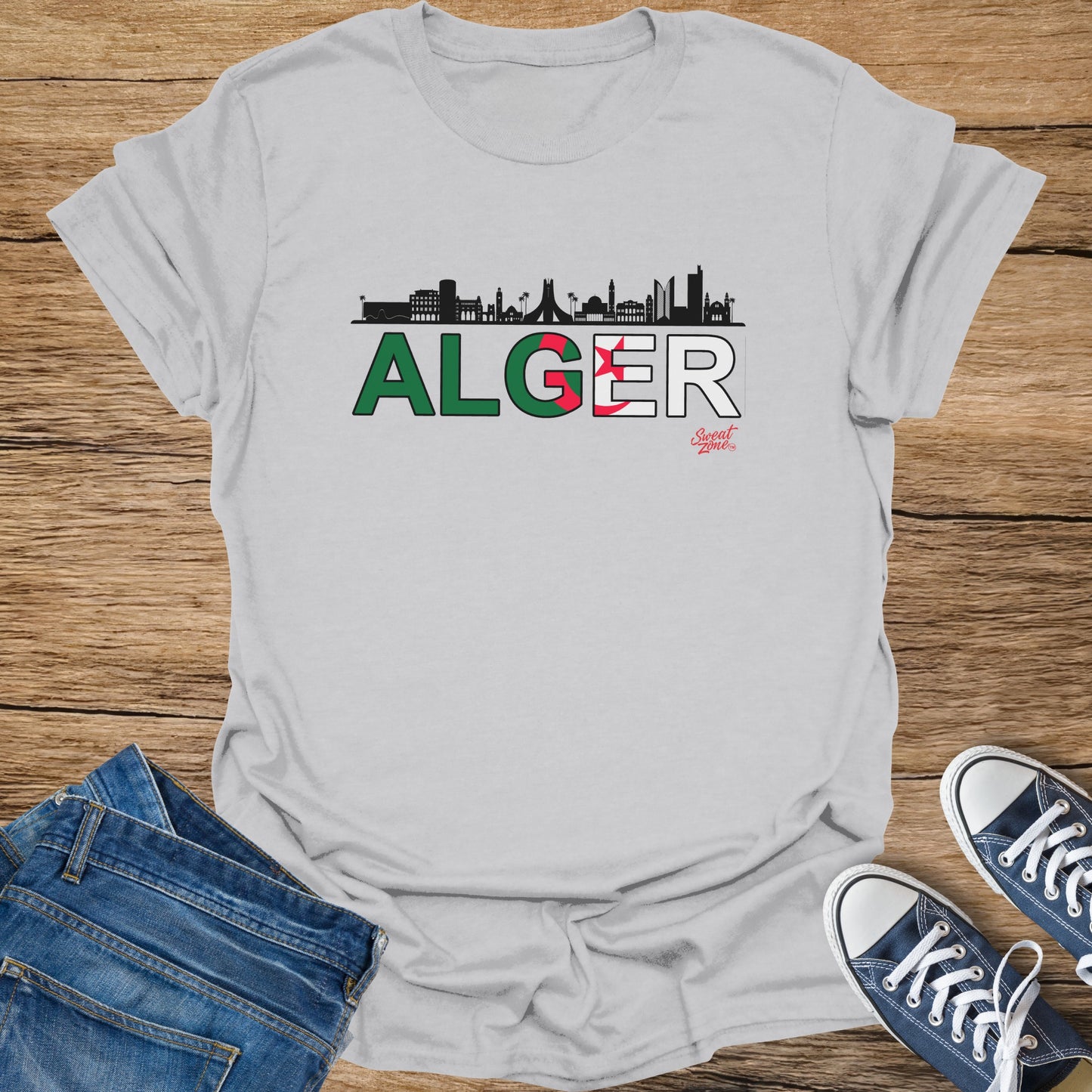 T-shirt with "ALGER" text, Algerian flag colors, and city skyline silhouette.