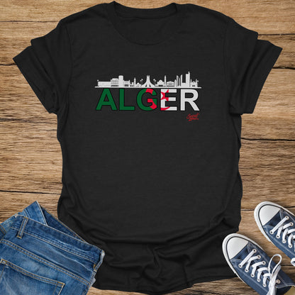 Black t-shirt with "ALGER" text and Algeria flag colors, featuring a city skyline.
