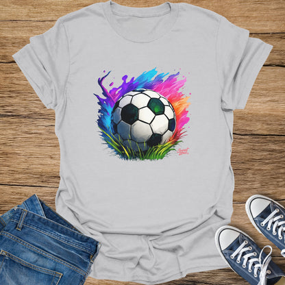 White t-shirt with a colorful abstract soccer ball graphic and water splashes.