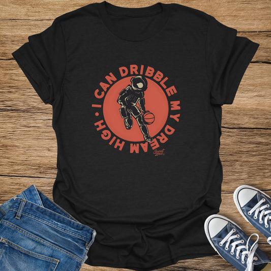 Black t-shirt with astronaut dribbling a basketball and text "I CAN DRIBBLE MY DREAM HIGH".