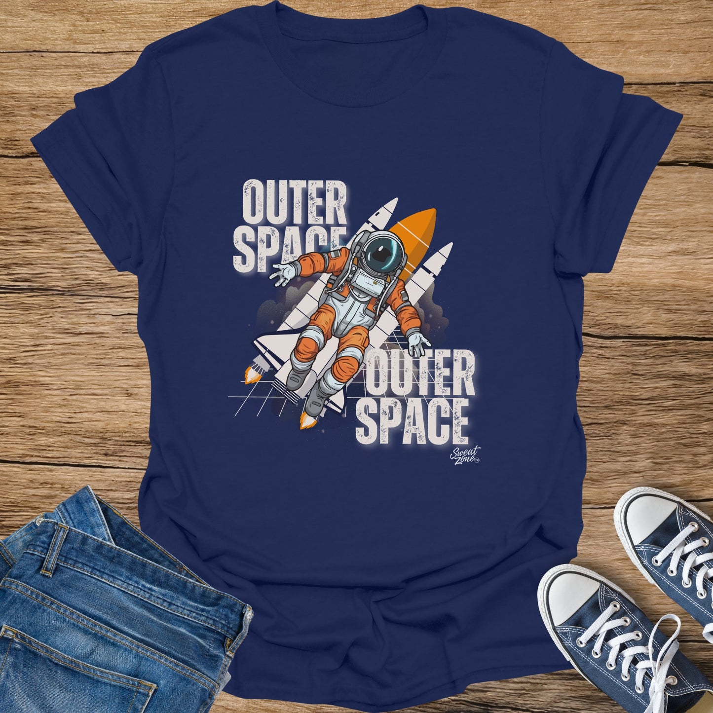 Navy t-shirt with "Outer Space" text and astronaut with rocket graphic.
