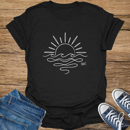 Black t-shirt with white line drawing of a sun setting over waves, and "Sweat Zone" logo.