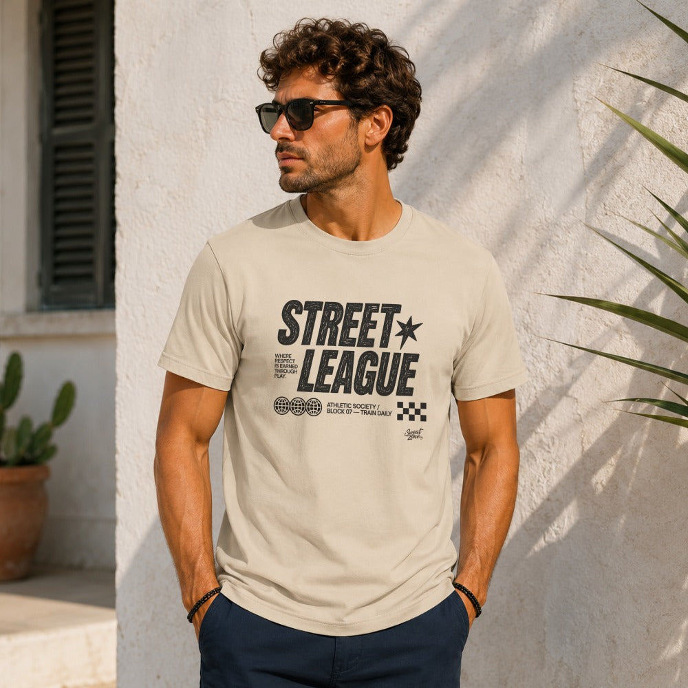 Beige t-shirt with "Street League" graphic, three globes, and checkered flag.