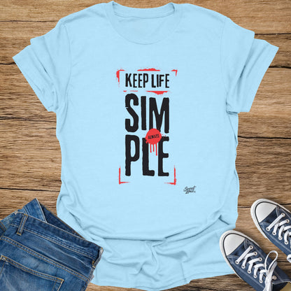 Light blue t-shirt with black text that reads "KEEP LIFE SIM ALWAYS PLE" and a red drip design.