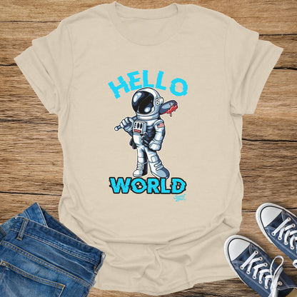 Astronaut with bloody axe and text "HELLO WORLD" on a beige t-shirt.