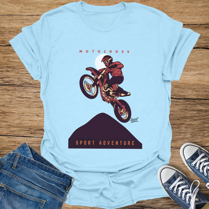 Light blue t-shirt with a motocross rider mid-air and "SPORT ADVENTURE" text.