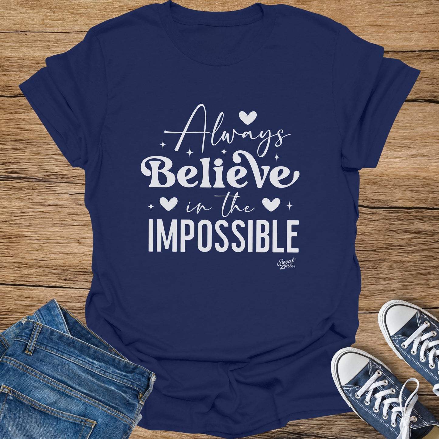 Navy t-shirt with white text "Always Believe in the IMPOSSIBLE"