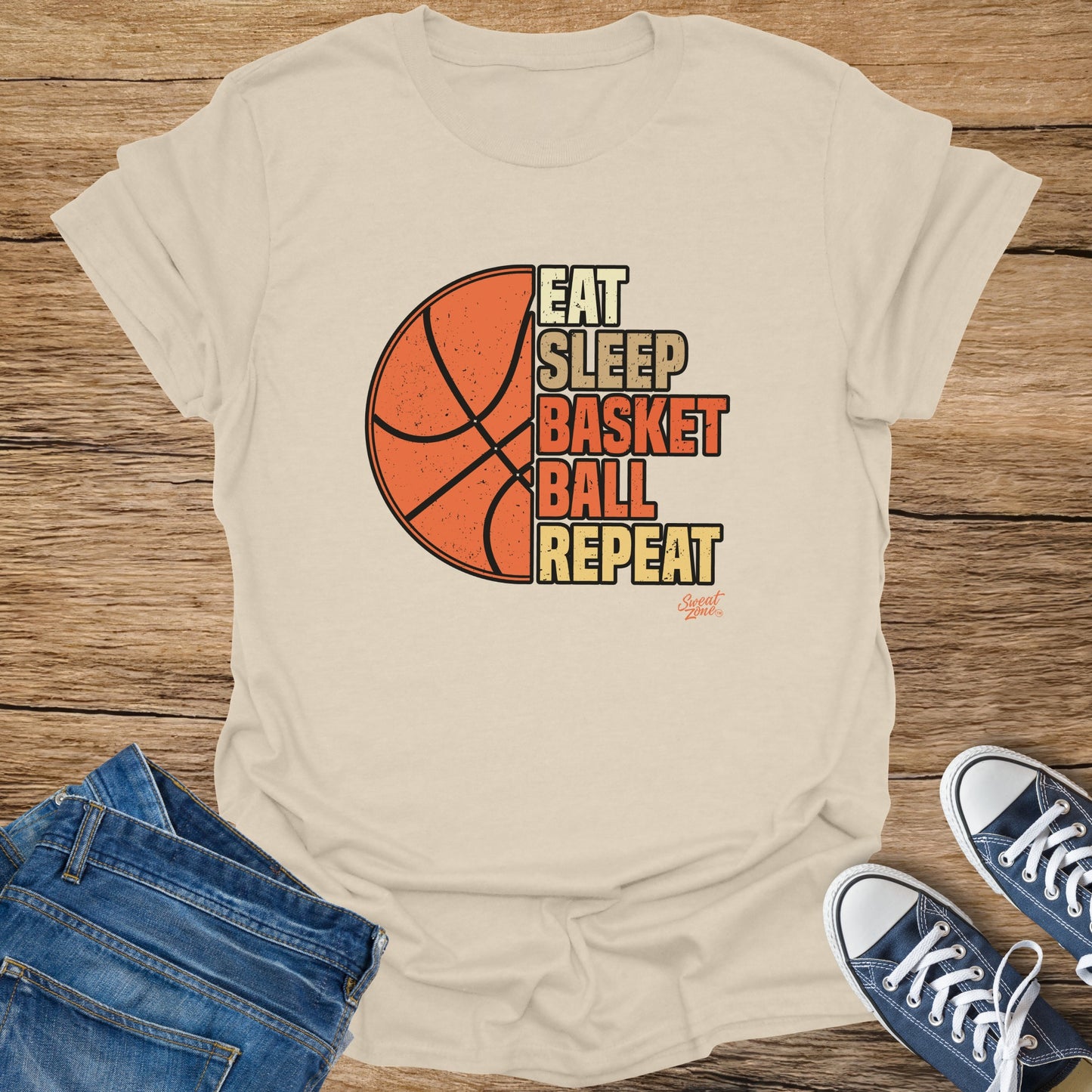 Light beige t-shirt with "Eat Sleep Basketball Repeat" text and basketball graphic.