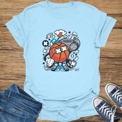 Cartoon basketball character with boombox and sneakers on light blue t-shirt.