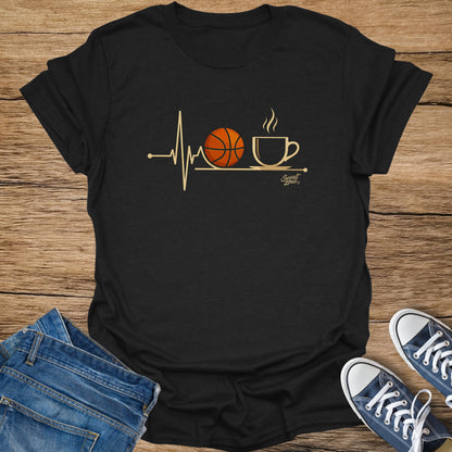 Black t-shirt with a gold heartbeat line, basketball, and coffee cup graphic.