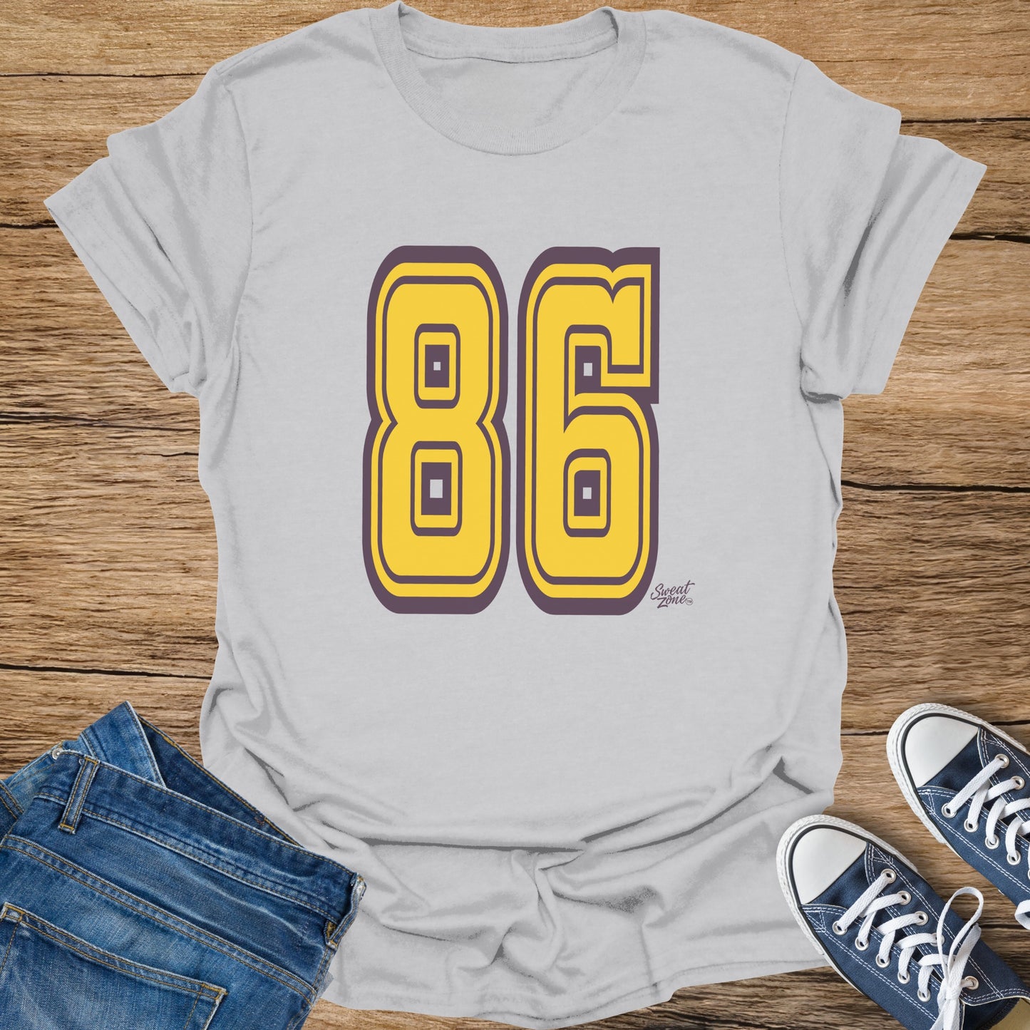 Light gray t-shirt with large yellow and purple number 86 design.