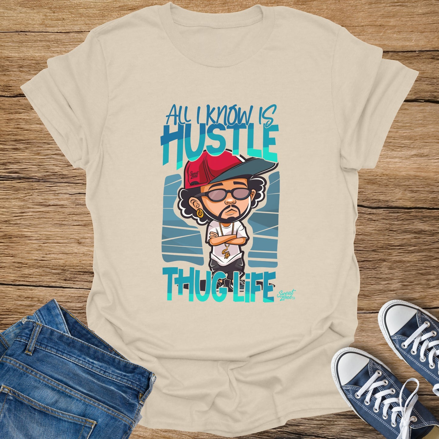 Chalk t-shirt with cartoon character and text "All I Know Is Hustle Thug Life".