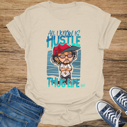 Chalk t-shirt with cartoon character and text "All I Know Is Hustle Thug Life".