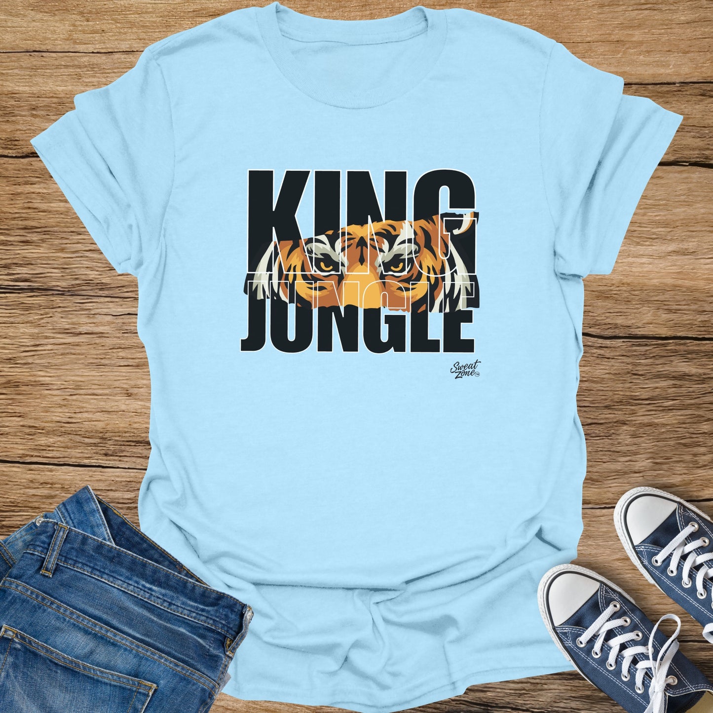 Light blue t-shirt with "KING JUNGLE" text and tiger graphic.