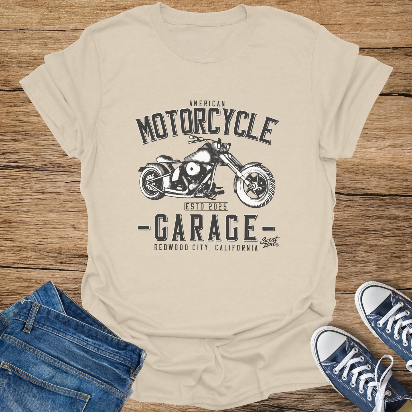 Cream t-shirt with "American Motorcycle Garage" graphic and motorcycle illustration.