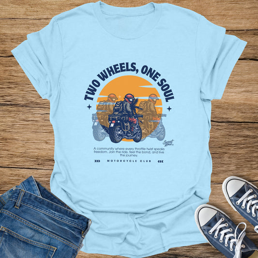 Light blue t-shirt graphic with "Two Wheels, One Soul" and motorcycle imagery.