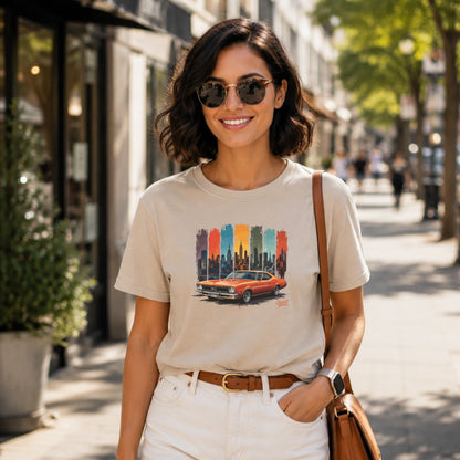 T-shirt features orange classic car graphic against a cityscape backdrop.
