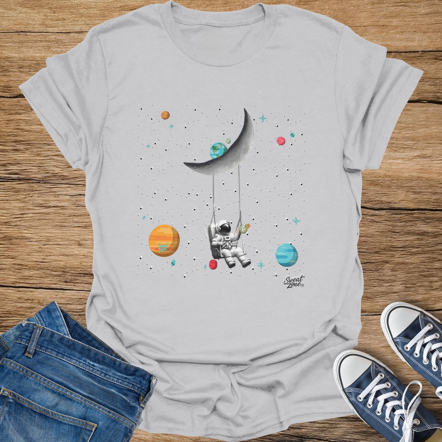 Astronaut on a swing from the moon, with planets and stars, and a rocket.