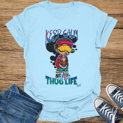 Light blue t-shirt featuring cartoon boy with text "KEEP CALM AND THUG LIFE".