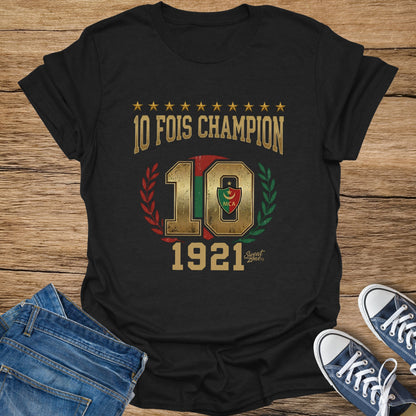 Black t-shirt with "10 FOIS CHAMPION" text, number 10, MCA logo, wreath, and "1921"