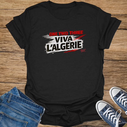 Black t-shirt with "ONE TWO THREE VIVA L'ALGERIE" text, with jeans and sneakers.