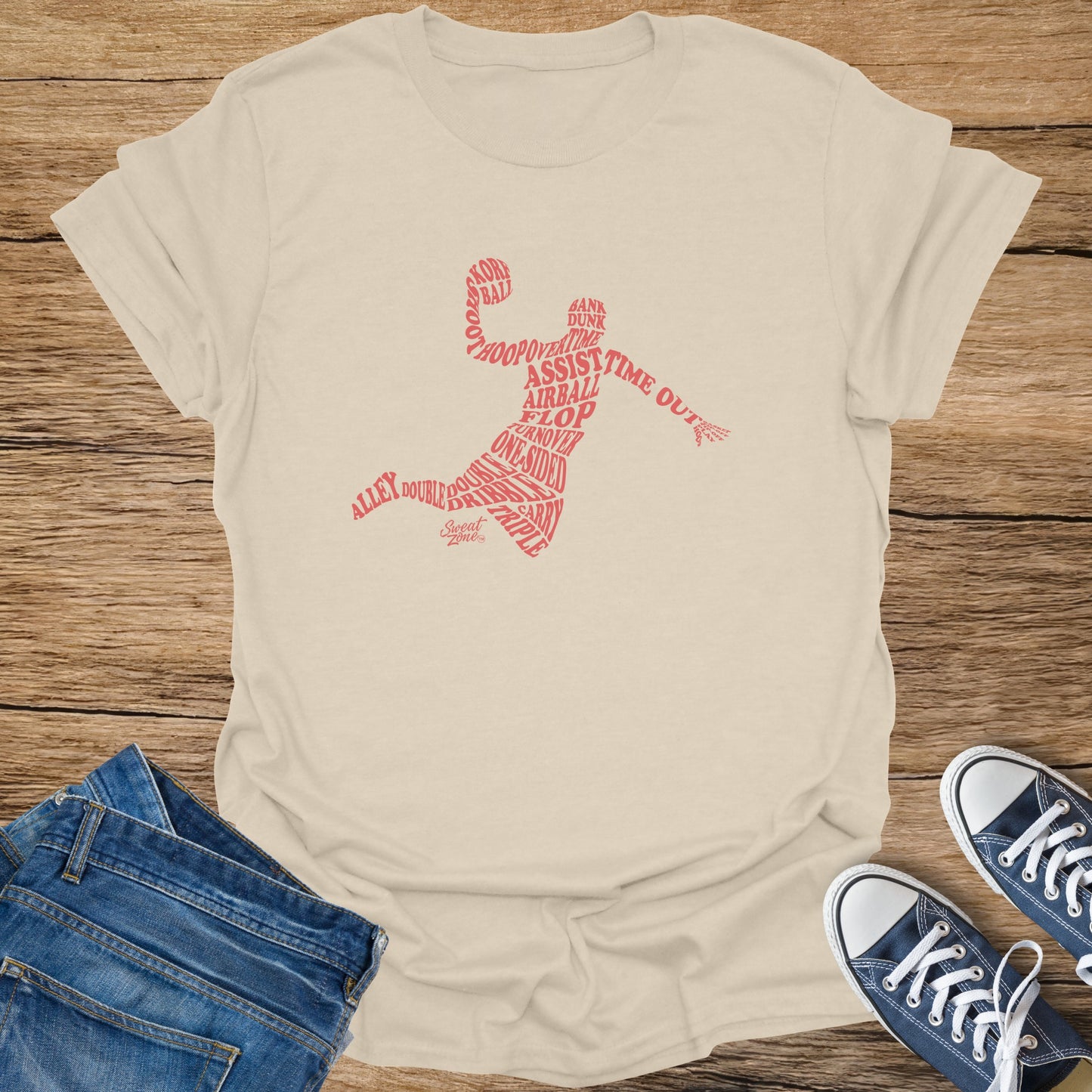 Light tan t-shirt with red basketball terms forming a player outline and name.