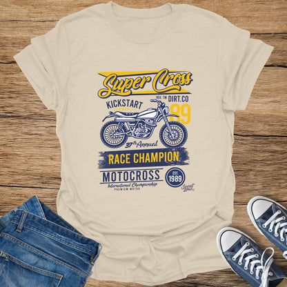 Cream t-shirt with "Super Cross Kickstart" motocross graphic, vintage motorcycle, and race champion text.