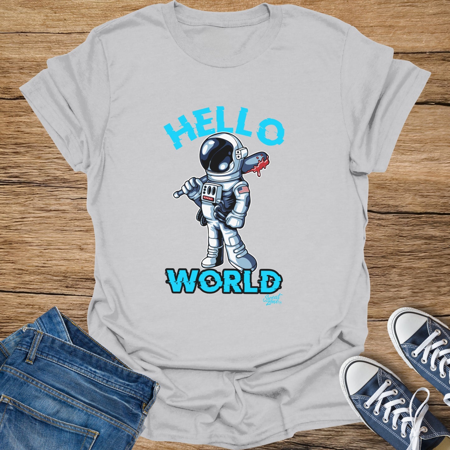 Light grey t-shirt with cartoon astronaut holding a bloodied wrench, text "HELLO WORLD".