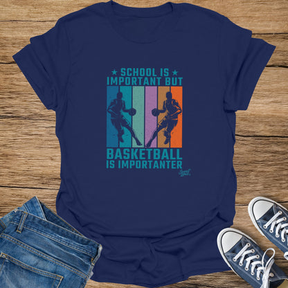 Navy t-shirt with "School is important but basketball is importanter" graphic.