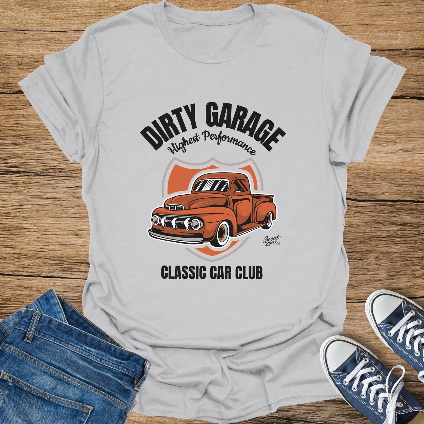 Grey t-shirt with distressed "Dirty Garage Highest Performance" text and orange pickup truck graphic.
