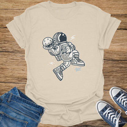 Astronaut holding a moon on a cream t-shirt with "Sweet Zone" logo.
