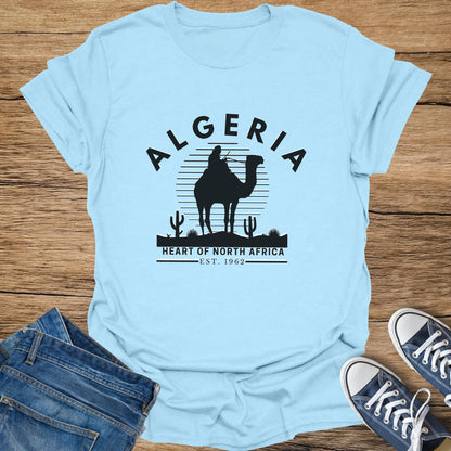 Light blue t-shirt with black camel silhouette, Algeria text, and "Heart of North Africa" graphic.