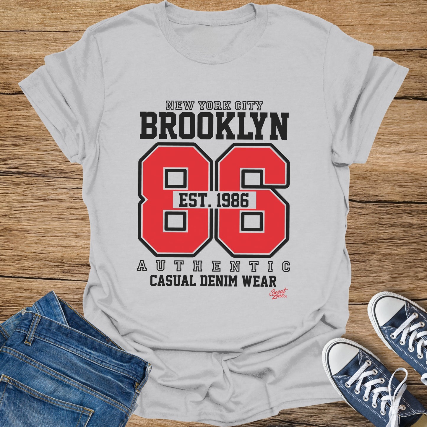 White t-shirt with "New York City Brooklyn 86 Est. 1986" graphic.