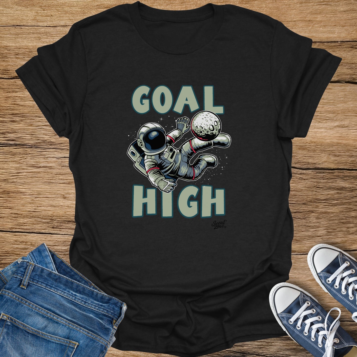 Astronaut playing soccer with the Moon, text "GOAL HIGH" and logo.