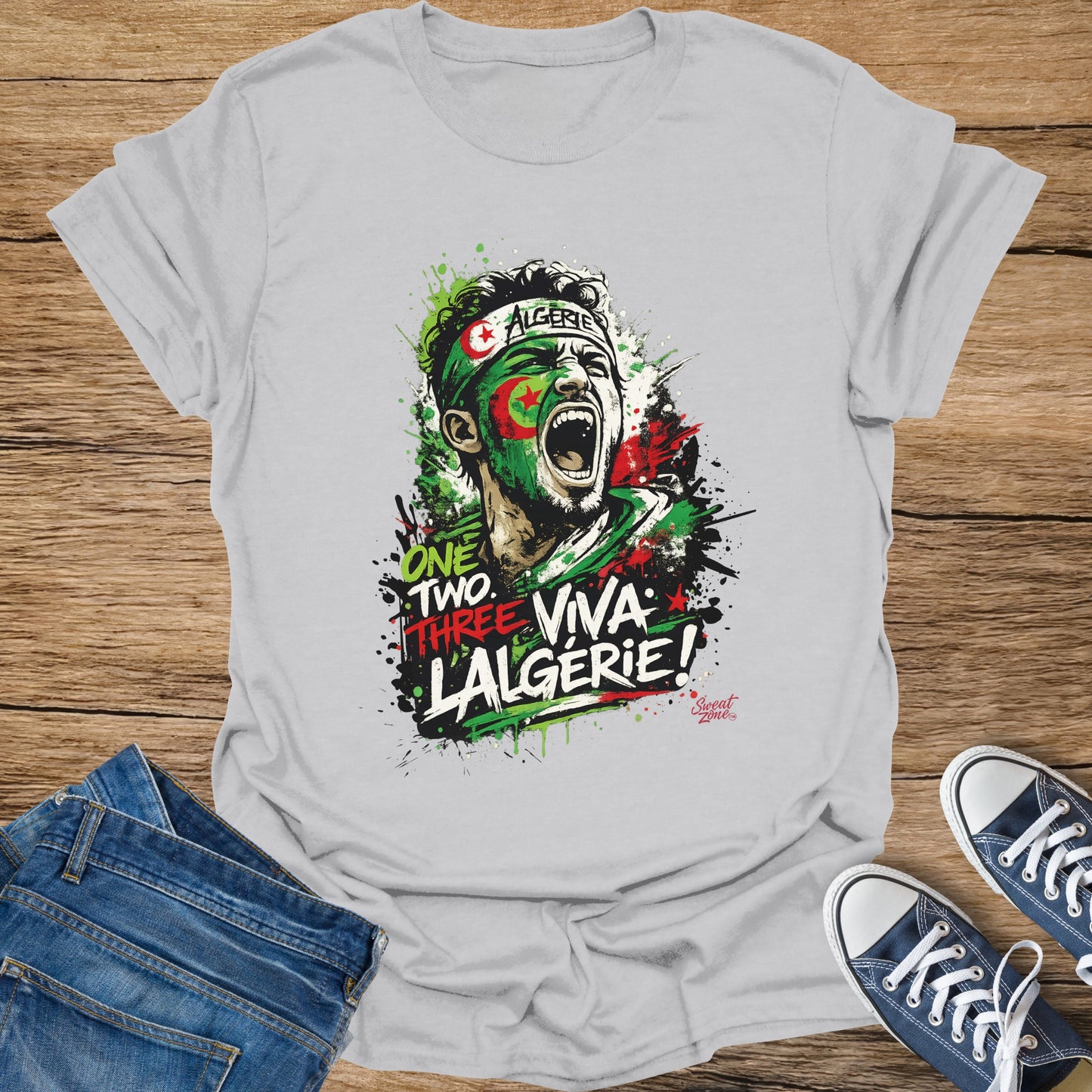 T-shirt graphic of a shouting soccer player with "One Two Three: Viva L'Algerie!" text.