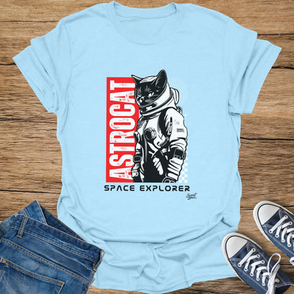 Light blue t-shirt with astronaut cat graphic and text "ASTROCAT SPACE EXPLORER".