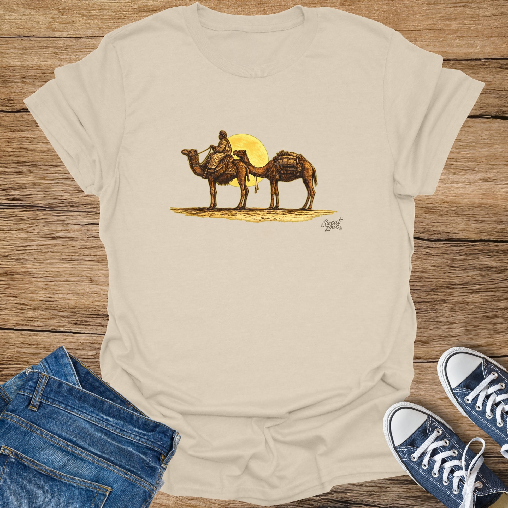Desert scene with two camels and a rider under a yellow sun.